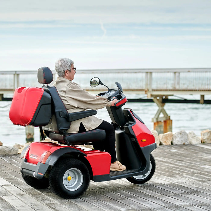 AFIKIM Afiscooter S3 3-Wheel Electric Mobility Scooter - Heavy Duty Scooter - Red Color with woman riding in the Bridge- Afikim Drive