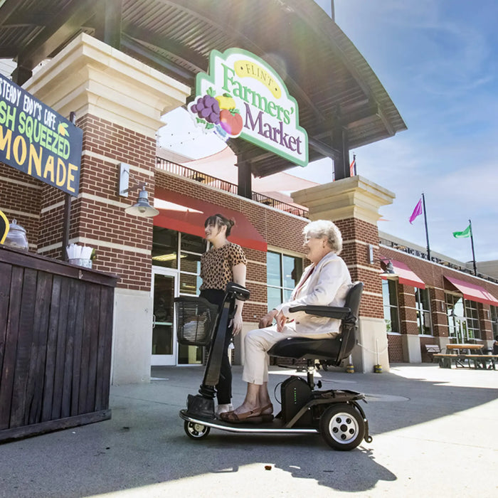 A woman riding the Amigo Viva Scooter 