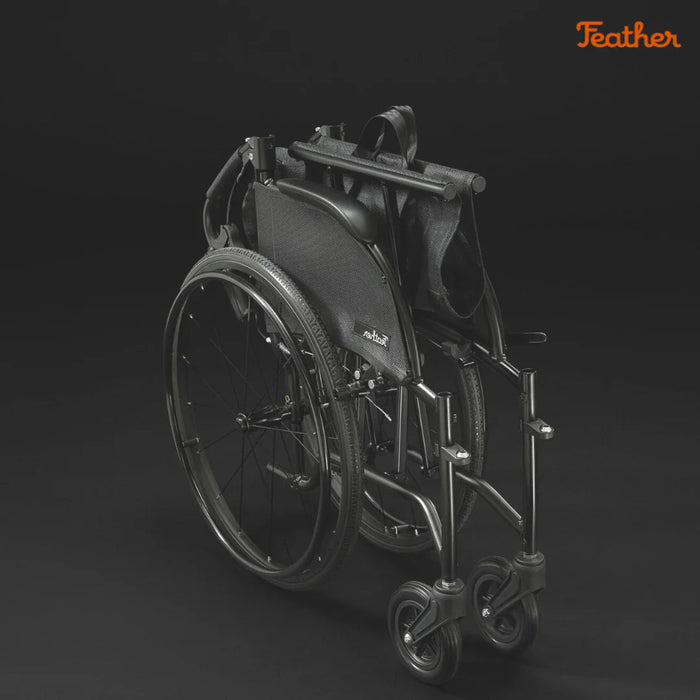 Black wheelchair on a dark background with 'Feather' Feather Mobilitybranding.