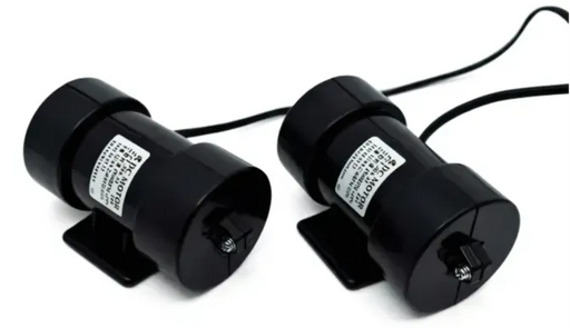 Two black cylindrical devices with labels on a white background Flexabed_Massage_Module