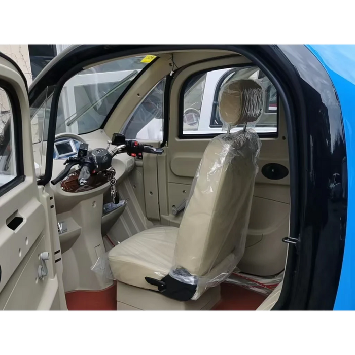 Interior of a small Gio Enclosed Mobility scooter vehicle with beige seats and dashboard.