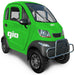 Green GIO Enclosed Mobility Scooter with enclosed weatherproof cabin, front bumper guard, windshield wiper, and compact electric mobility design.