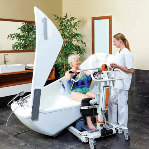 The Avero Motion Bath Tub by Handicare with user and caregiver