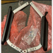 Metal frame with black handles on a red bubble wrap background The Journey Zoomer Handrail Set includes the right and left armrests