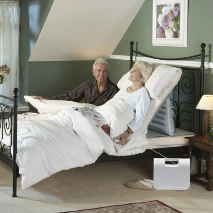 Mangar Handy Inflatable Pillow Lift with Airflo 12 Compressor showing an elderly using the product.
