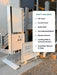 An outdoor residential wheelchair lift tower and ramp system installed beside a building, with a white included-items list panel overlaid on the right side.