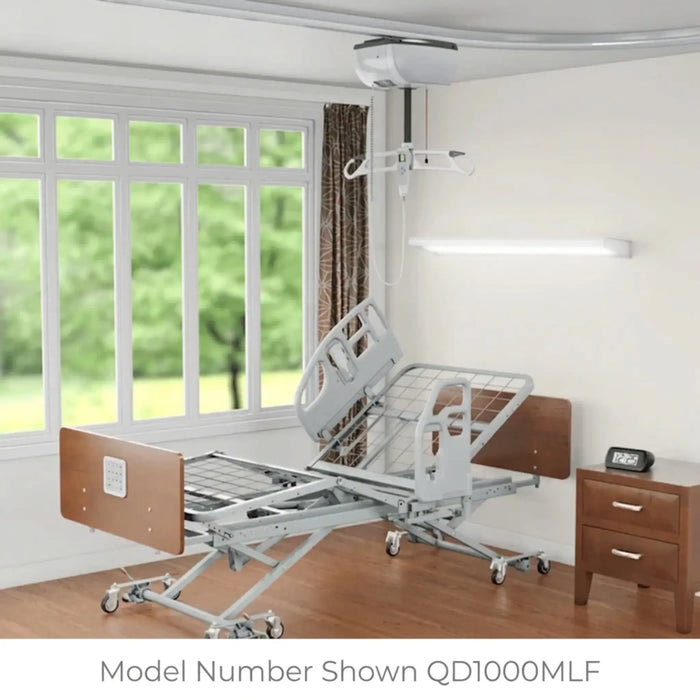 Hospital bed in a room with a window and nightstand Q Series Advantage Low Bed – Adjustable Electric Bed 