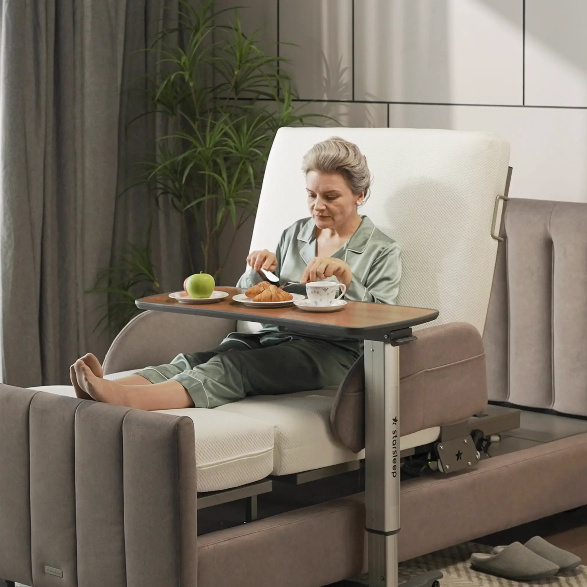 Orin Rotating Bed by StarSleep: Effortless Sit-to-Stand Luxury Adjustable Hospital Bed with Person Eating in a Bed