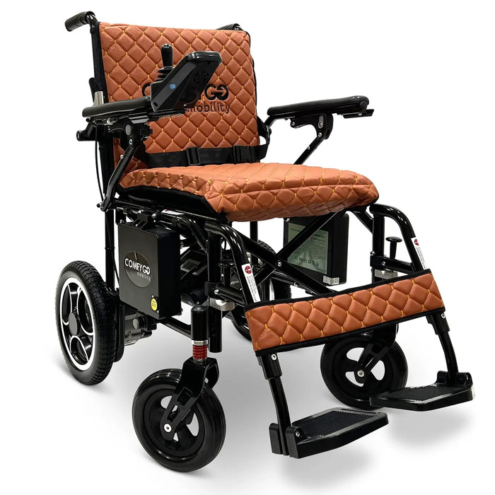 Electric wheelchair with brown quilted seat and backrest on a white X7BlackFrameTabaTextilebackground