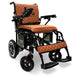 Electric wheelchair with brown quilted seat and backrest on a white X7BlackFrameTabaTextilebackground