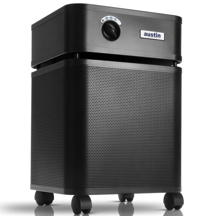 Austin Air HealthMate Plus air purifier, black, front angle view on casters