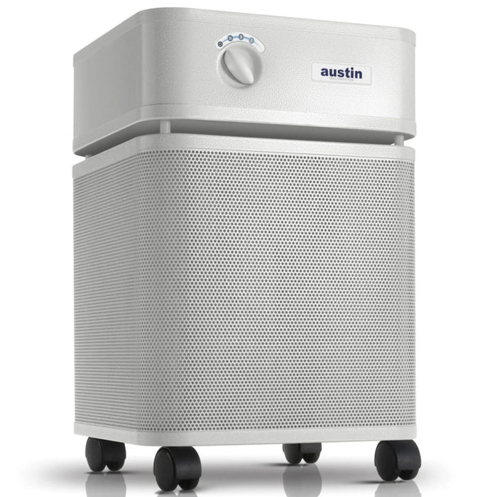 Austin Air HealthMate Plus air purifier, sandstone, front angle view on casters