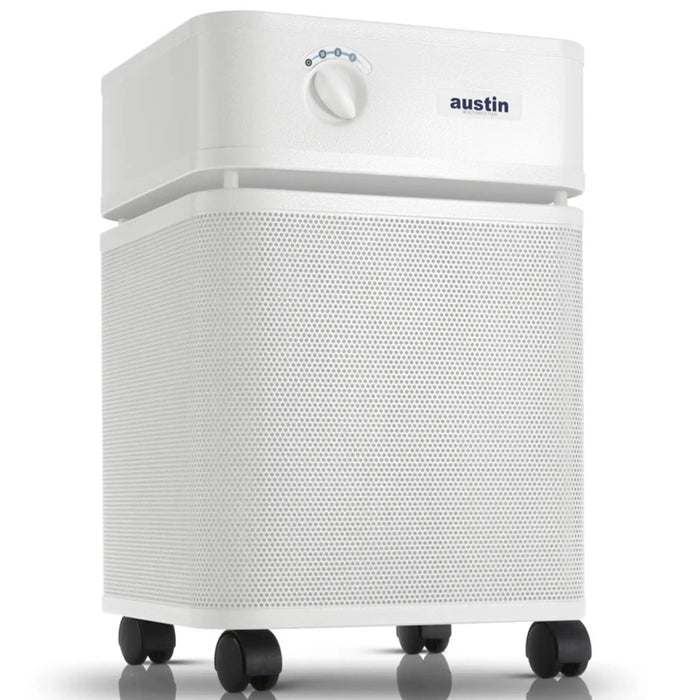 Austin Air HealthMate Plus air purifier, white, front angle view on casters