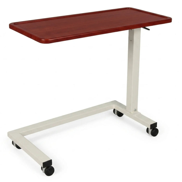 CostCare BZT330 long-term care overbed table with cherry woodgrain tabletop, adjustable-height metal frame, and rolling caster wheels.