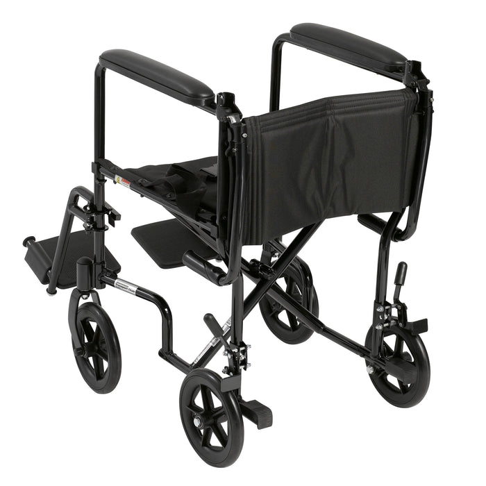 Rear three-quarter view of the black Drive aluminum transport chair with folding back, wheel locks, and footrests.