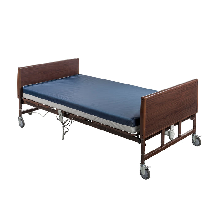 Drive bariatric homecare bed shown flat with a blue mattress and wood-grain bed ends