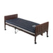 Drive Delta Pro electric hospital bed shown flat with a blue mattress and brown molded bed ends