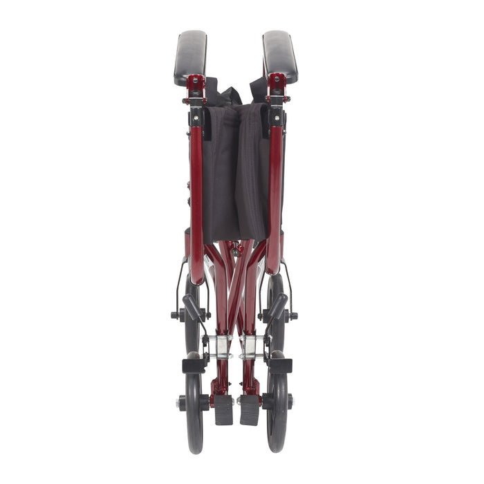 Red Drive Lightweight Transport Chair folded closed, showing its narrow profile for storage and travel.