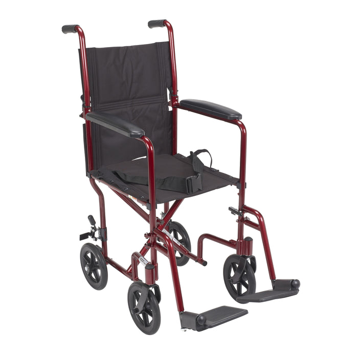 Red Drive Lightweight Transport Chair in front view with seat belt and swing-away footrests.