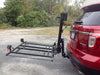 Wheelchair Carrier XL4 hitch-mounted scooter lift lowered behind SUV