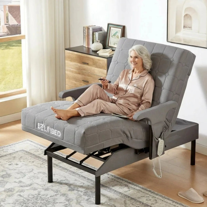 EZLift Bed Deluxe Sleep To Stand Bed in Zero Gravity Position with a senior woman reclining comfortably while using a remote control, promoting pressure relief, circulation, and full-body relaxation.