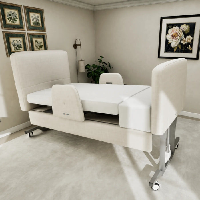Angled view of the EZLift Bed Elevra Deluxe Rotating Hi-Lo Lift Bed in a fully flat position, highlighting its upholstered frame, transfer support panels, and premium mattress surface.