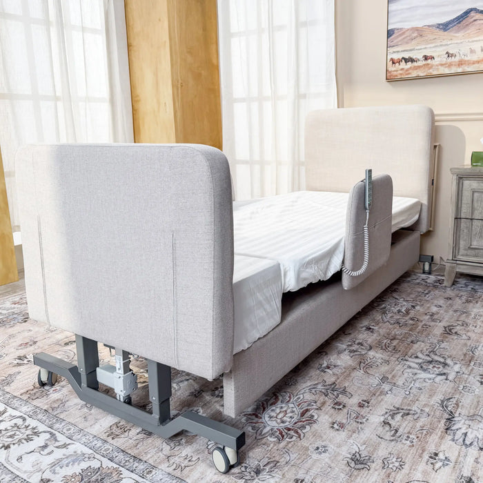 Rear corner view of the EZLift Bed Elevra Deluxe Rotating Hi-Lo Lift Bed showcasing the upholstered headboard, adjustable frame, and mobility casters.