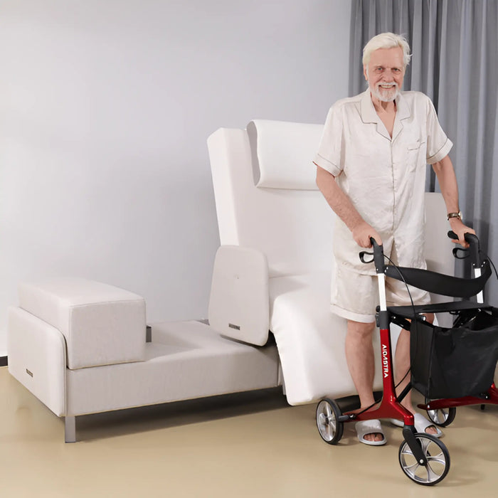 Older adult standing beside the EZLift Bed Elevra Rotating Adjustable Bed with a rollator walker after a safe assisted transfer from the bed.