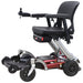FreeRider Luggie portable travel power wheelchair, red, side angle view