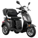 Front angled view of the black GIO Regal 3-Wheel Mobility Scooter with a windshield, showcasing the padded captain seat, armrests, rear storage compartment, LED lighting, and modern body styling.