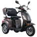 Studio shot of the brown GIO Regal 3-Wheel Mobility Scooter with a windshield, highlighting the padded captain seat, rear trunk storage, alloy wheels, and sleek three-wheel scooter design.