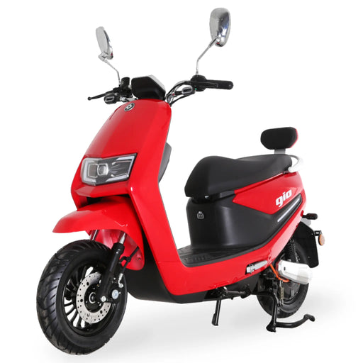 Red GIO Supra street-legal electric scooter displayed in a front three-quarter angle featuring LED lighting, front disc brakes, mirrors, rear backrest, and sleek city-ready design.