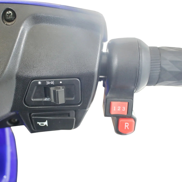 Close-up of GIO Tron Pro mobility scooter handlebar controls with speed selector, reverse button, horn, and lighting switch.