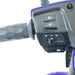 Close-up of GIO Tron Pro scooter handlebar controls showing headlight switches, turn signal controls, and horn button.