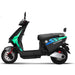 Side profile of the black GIO Ultron seated electric scooter with streamlined frame, front disc brake, rear suspension, and urban commuter styling.