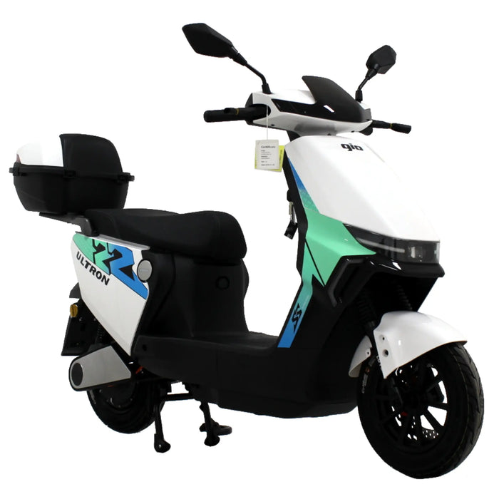 White GIO Ultron seated electric scooter featuring rear storage compartment, black seat, and sleek urban commuter styling shown in angled front view.