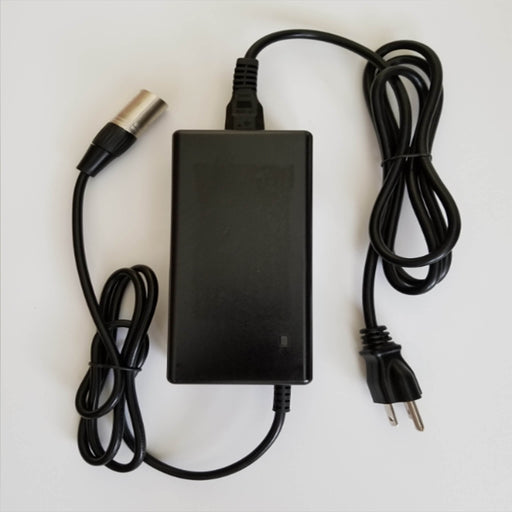 The HandyScoot™ battery charger is rated for Input: AC100V – 240V, 1.8A MAX, 50-60Hz. Output: 42V, 2A. It has a US plug and can be used internationally with the use of a local plug adapter. When the battery is charging, a red light will appear on the charger. When the battery is fully charged, the light will change to green. Total cord length: 9′. Box: 6.5″ x 2″ H x 3″ H. 1.5 lbs.  The purchase of a HandyScoot™ includes a charger. You can purchase this charger as an extra or replacement.