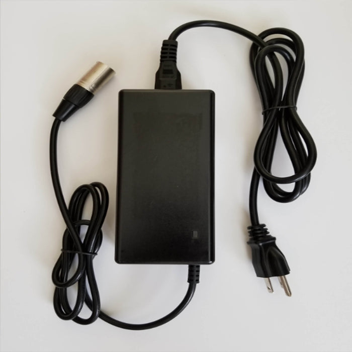 The HandyScoot™ battery charger is rated for Input: AC100V – 240V, 1.8A MAX, 50-60Hz. Output: 42V, 2A. It has a US plug and can be used internationally with the use of a local plug adapter. When the battery is charging, a red light will appear on the charger. When the battery is fully charged, the light will change to green. Total cord length: 9′. Box: 6.5″ x 2″ H x 3″ H. 1.5 lbs.  The purchase of a HandyScoot™ includes a charger. You can purchase this charger as an extra or replacement.