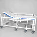 Healthline Bariatric Reclining Shower Gurney with blue pad, full-length rails and eight locking wheels