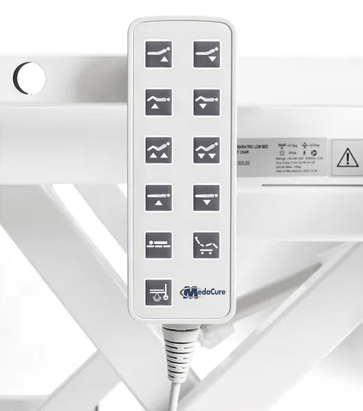 Control panel with icons and 'MedaCure' branding on a medical  Medacure DLX600-CLS Bariatric Full-Electric Beddevice.