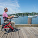 Nitro Sprint Rollator Rolling Walker, Red a man sitting on it view