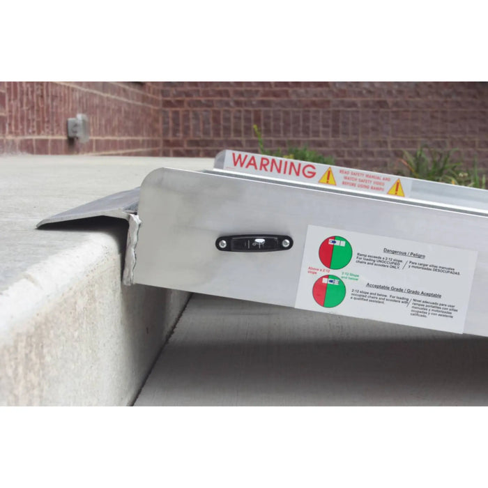 PVI multifold ramp shown from the side with safety label and raised edge at a porch step