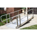 Side view of PVI OnTrac ramp with dual handrails installed at residential entry for wheelchair or scooter use