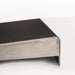 PVI self-supporting threshold ramp positioned against a raised threshold with black traction surface