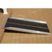 PVI solid ramp installed at a raised threshold with black traction surface and aluminum side rails