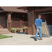 PVI Wheel-A-Bout ramp being rolled into a garage using built-in wheels for easy transport and storage