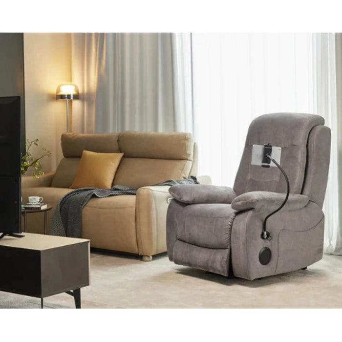 StarSleep Starise zero gravity lift chair in gray placed in living room next to sofa and TV with phone holder attached