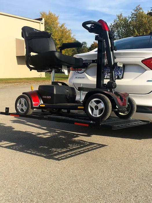 Wheelchair Carrier Patriotic electric scooter lift carrying a red mobility scooter