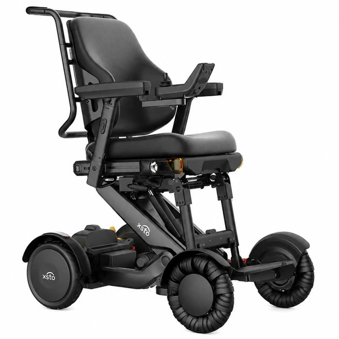 Front three-quarter view of the XSTO M4 Pro Smart Electric Wheelchair highlighting its ergonomic seating system, powered controls, suspension, and modern mobility design.