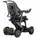 Rear three-quarter view of the XSTO M4 Pro Smart Electric Wheelchair displaying the supportive backrest, battery housing, suspension components, and compact chassis design.